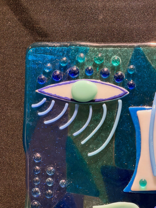 Detail view of She Who Sees Through, handmade fused glass by Paige's Glass Art.