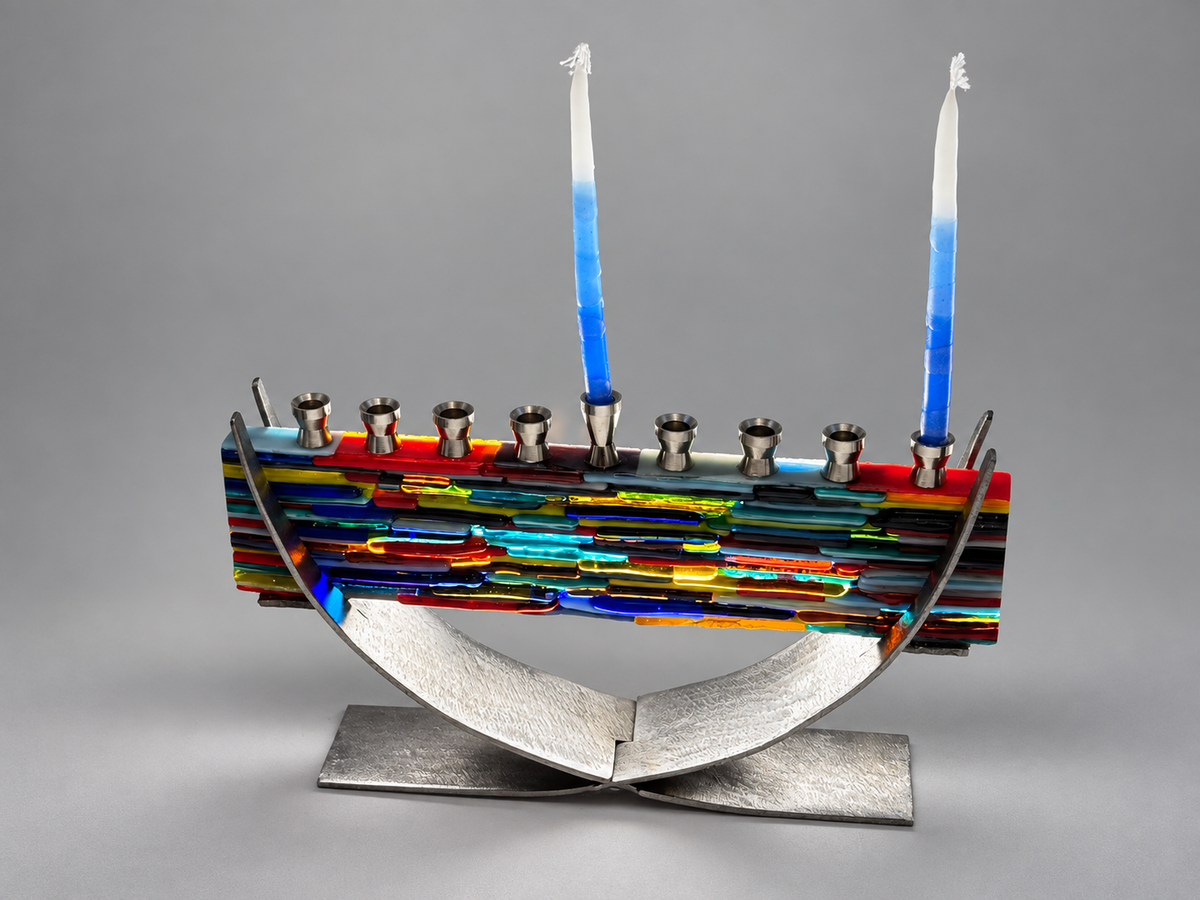 Shared Hands Menorah in fused glass and steel by Paige's Glass Art.