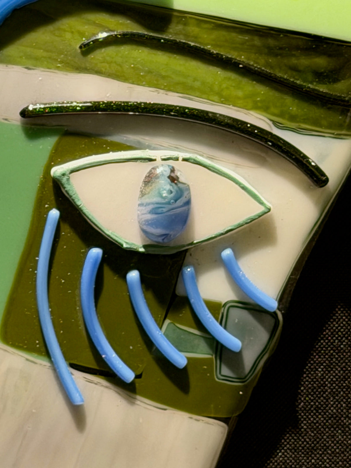Detail view of The Green Gaze, handmade fused glass by Paige's Glass Art.