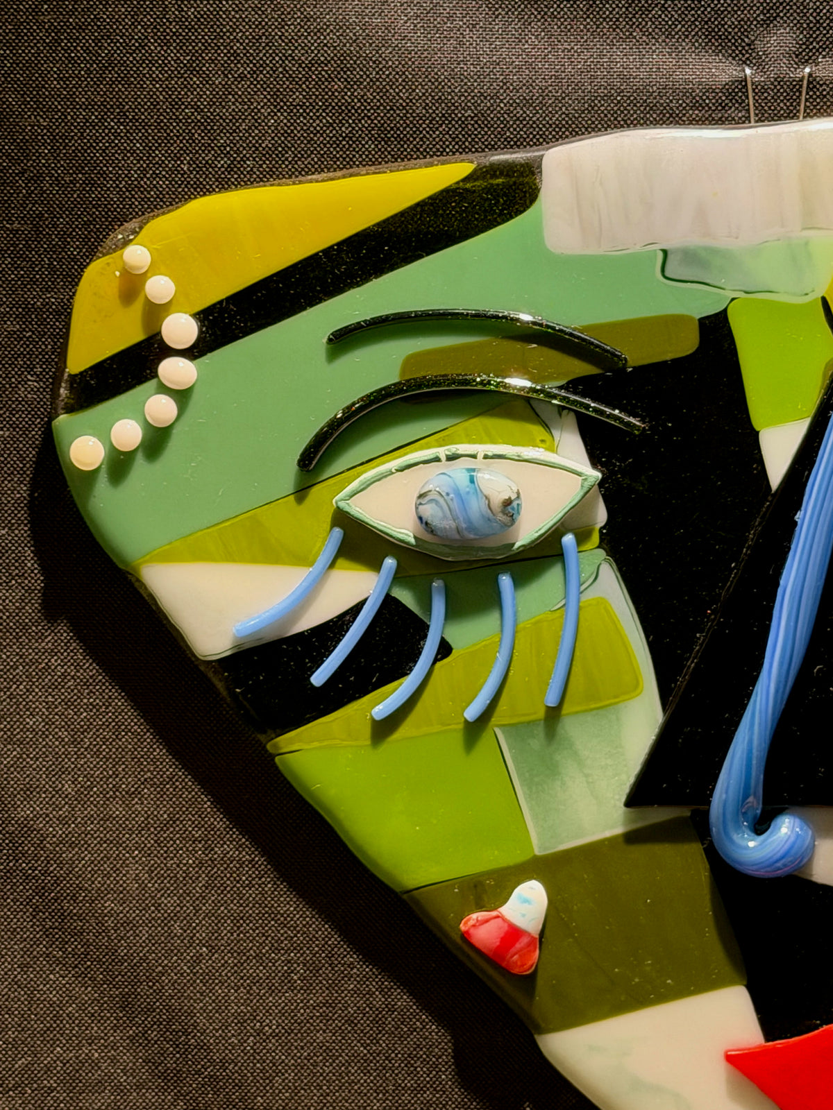 Detail view of The Green Gaze, handmade fused glass by Paige's Glass Art.